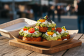 Crispy roasted sweet potato slices topped with creamy avocado, crumbly feta, and fresh tomatoes.